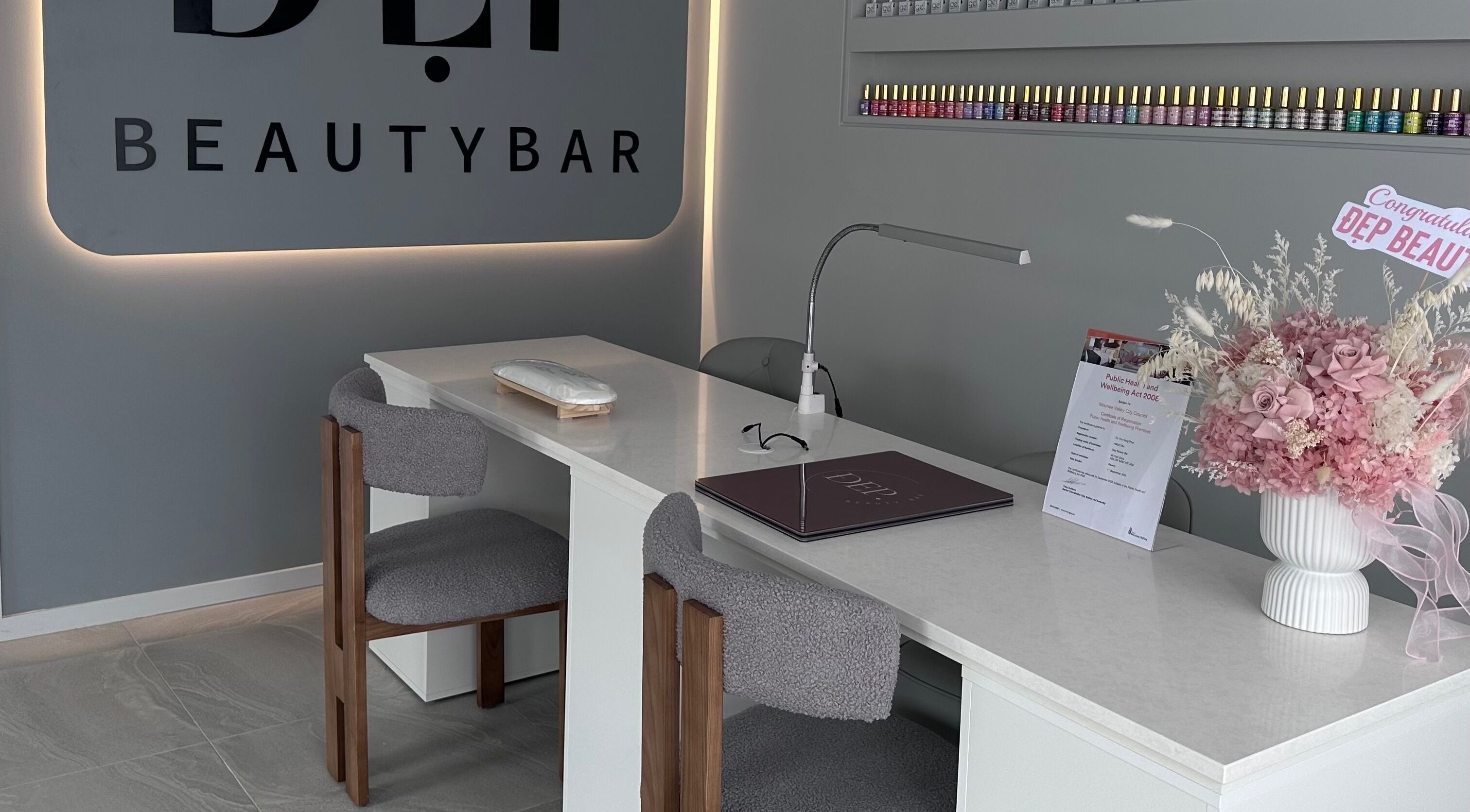 Elegant nail salon setup at Dep Beauty Bar in Melbourne, Victoria, AU showcasing a modern manicure station.