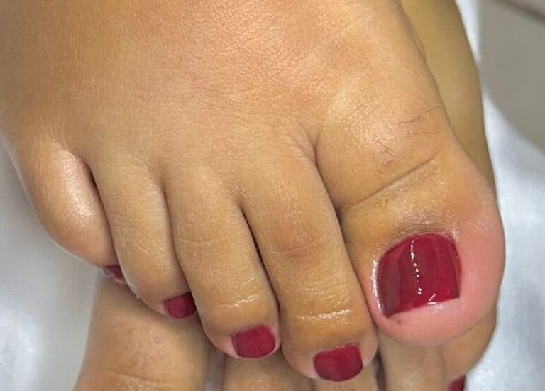 Close-up of a pedicure with red polish at DJ Sala de Belleza, Ciudad Tula, Tamaulipas, MX.