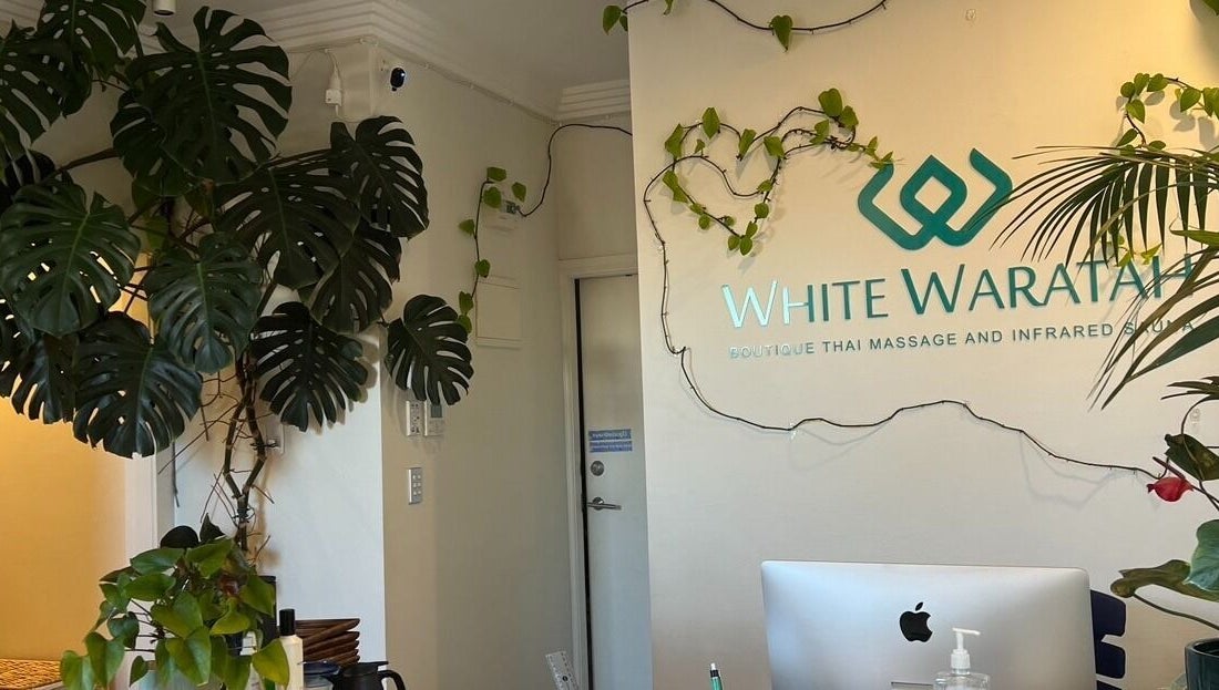 Entrance of WHITE WARATAH BOUTIQUE THAI MASSAGE AND INFRARED SAUNA, featuring lush plants in Rozelle, New South Wales, AU.