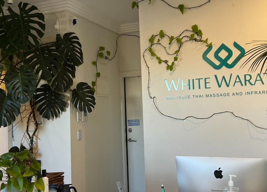 Entrance of WHITE WARATAH BOUTIQUE THAI MASSAGE AND INFRARED SAUNA, featuring lush plants in Rozelle, New South Wales, AU.