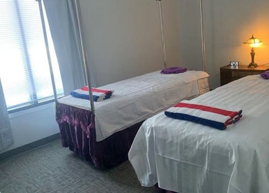 Cozy massage room with twin beds at Easy Garden Relaxation, Columbus, Ohio, US. Perfect for serene rejuvenation.