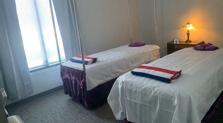 Cozy massage room with twin beds at Easy Garden Relaxation, Columbus, Ohio, US. Perfect for serene rejuvenation.