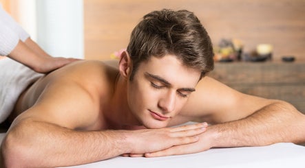 Man enjoys relaxing massage at Easy Garden Relaxation, Columbus, Ohio, US, fostering rejuvenation and serenity.