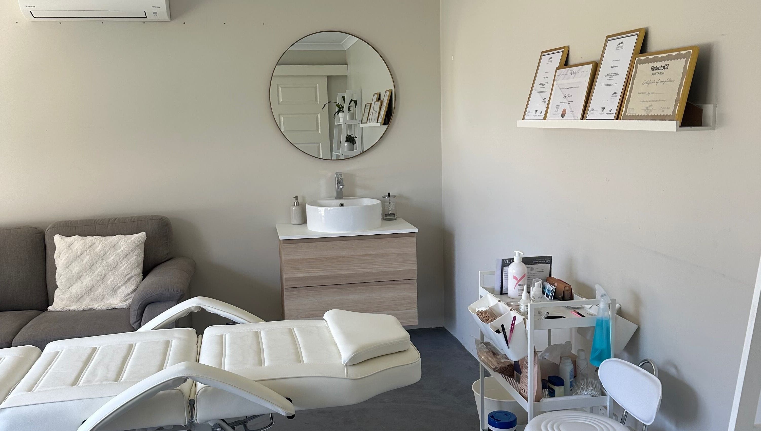 Serene treatment room at SVV Beauty, Carramar, Western Australia, AU featuring a modern sink and cozy seating.