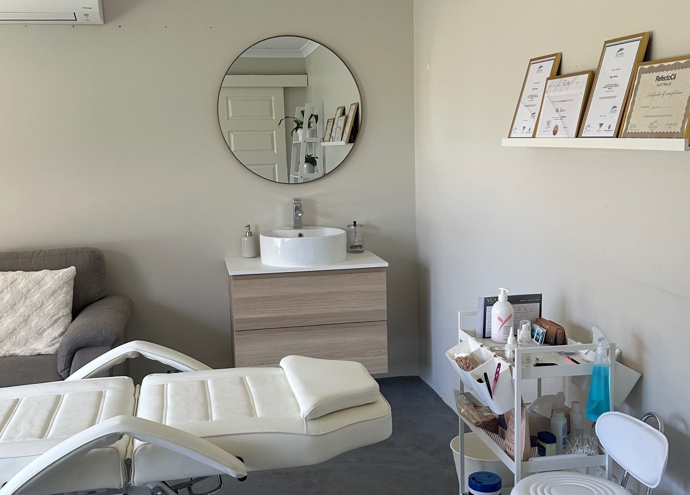 Serene treatment room at SVV Beauty, Carramar, Western Australia, AU featuring a modern sink and cozy seating.
