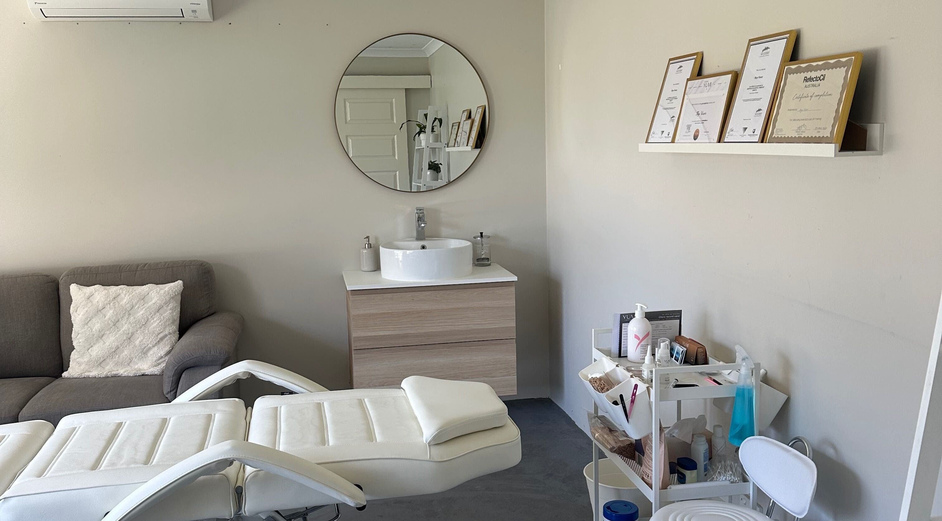 Serene treatment room at SVV Beauty, Carramar, Western Australia, AU featuring a modern sink and cozy seating.
