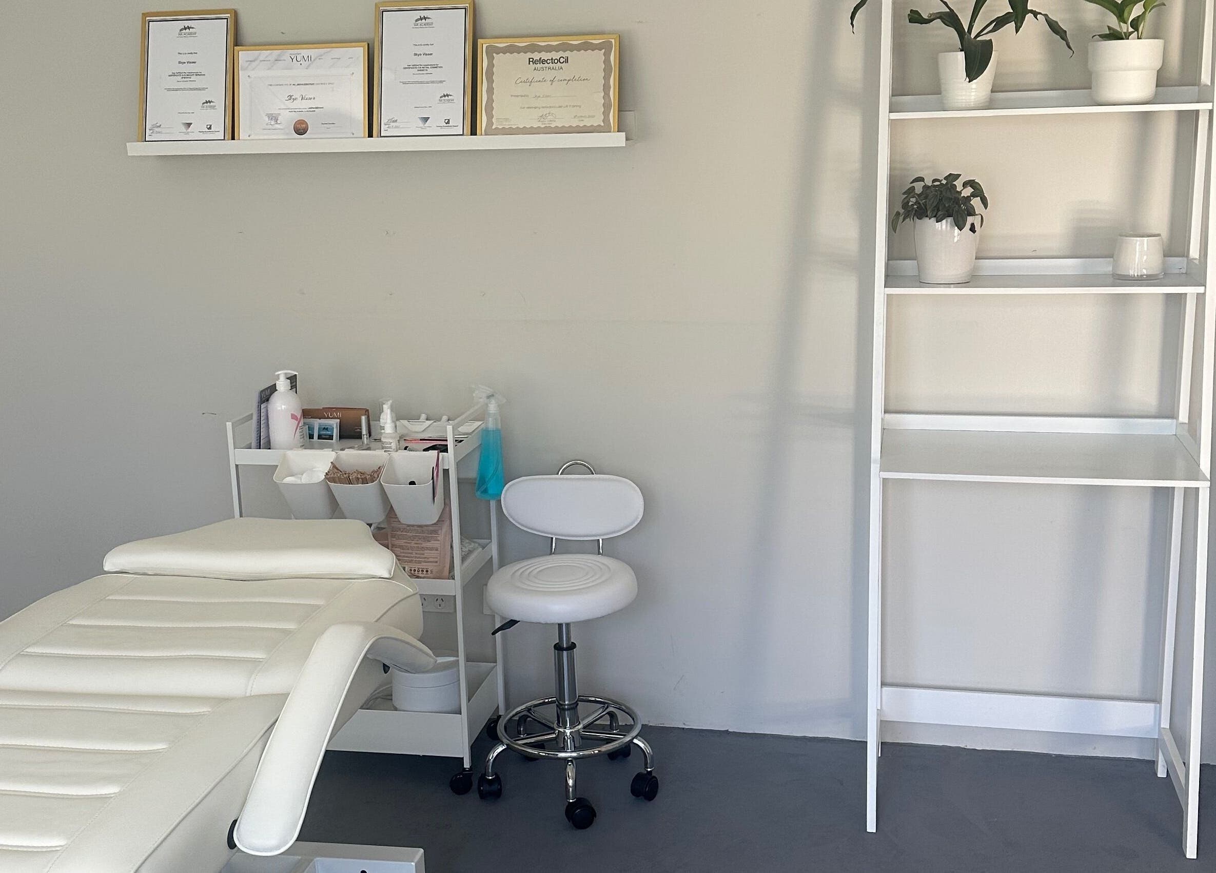 SVV Beauty treatment room with white chair and shelves, Carramar, Western Australia, AU.