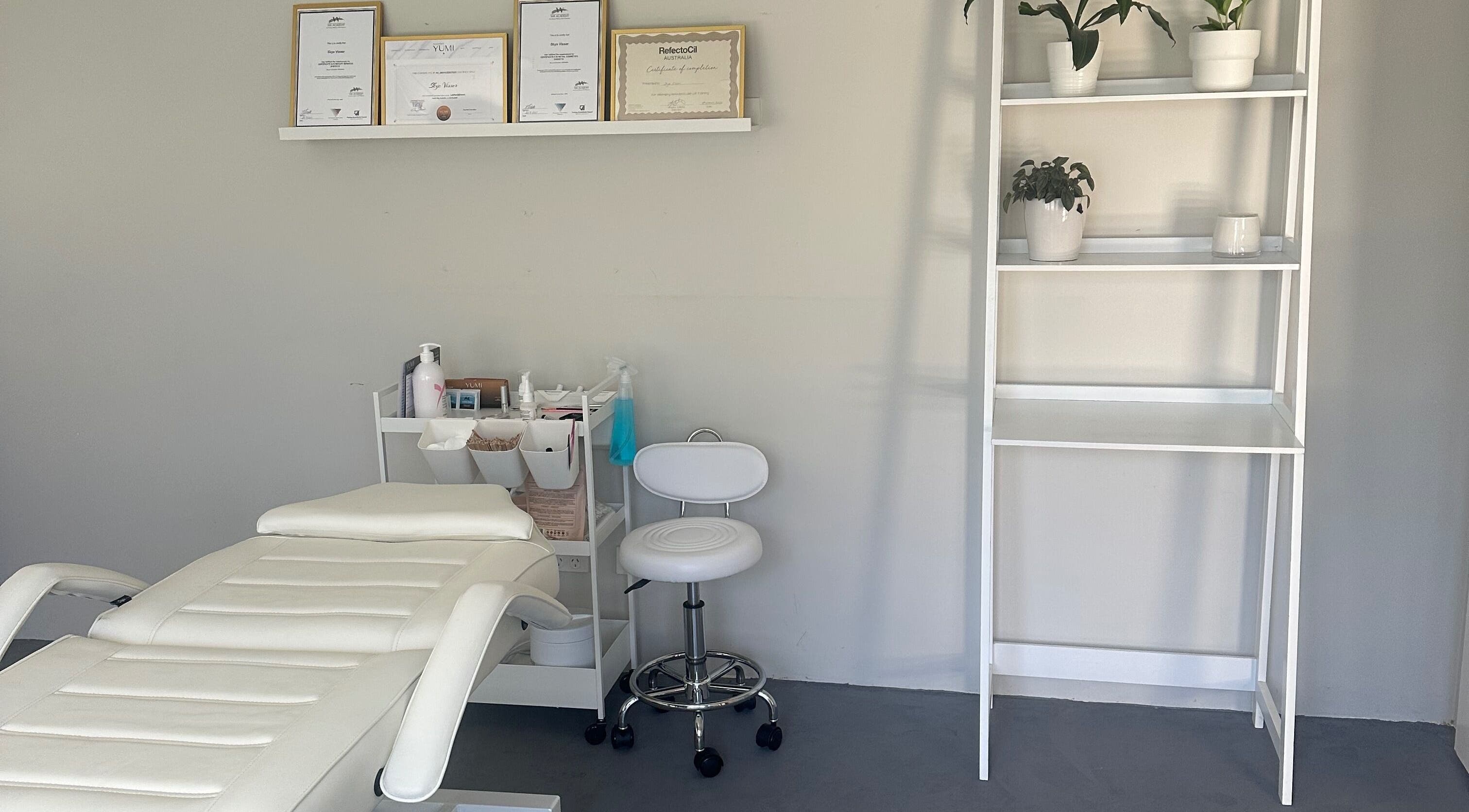 SVV Beauty treatment room with white chair and shelves, Carramar, Western Australia, AU.