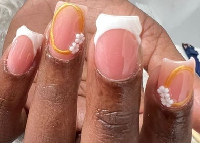 Elegant nail art with floral design at Tjizaa Beauty Haven, Windhoek, Khomas Region, NA.