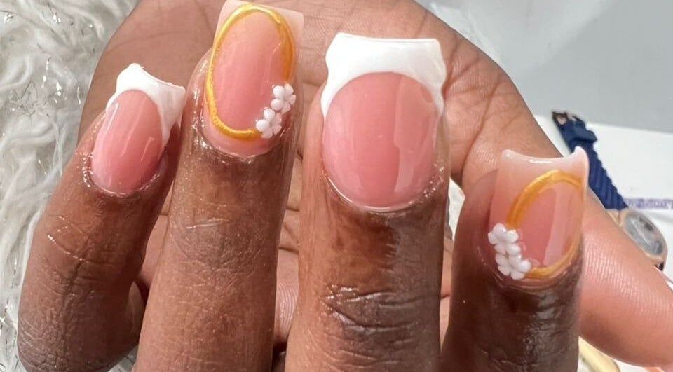 Elegant nail art with floral design at Tjizaa Beauty Haven, Windhoek, Khomas Region, NA.