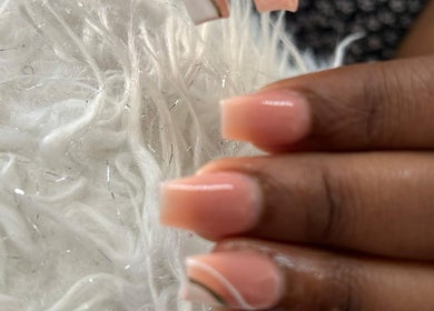 Close-up of a stylish pink manicure at Tjizaa Beauty Haven, Windhoek, Khomas Region, NA.