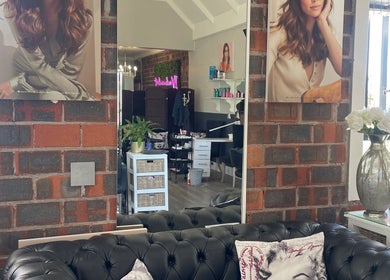 Cozy salon interior at Styled by Sandra @ Lush, Cape Town, Western Cape, ZA with modern decor and plush seating.