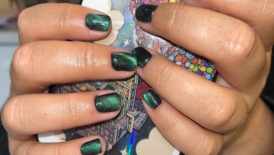 Intricate emerald nail art at J’AdoreClou, Abram, England, GB. Perfect for a stylish and chic look.