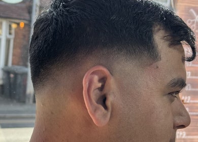 Close-up of sleek taper fade haircut at NBKTheBarber, Saint Helens, England, GB.