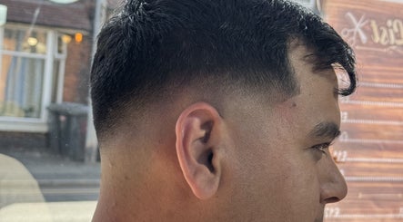 Close-up of sleek taper fade haircut at NBKTheBarber, Saint Helens, England, GB.