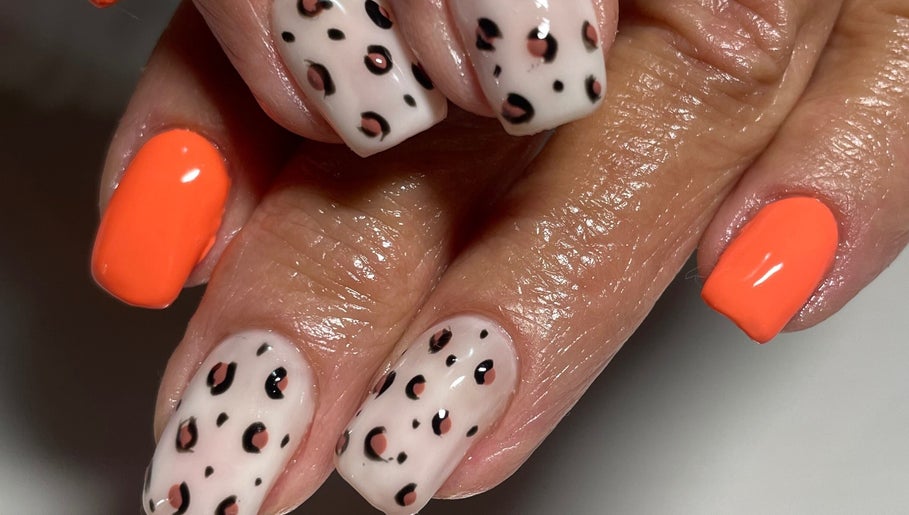 Stylish leopard and orange nails at Dandelion Beauty in Bethal, Mpumalanga, ZA.