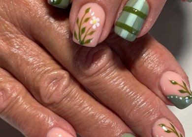 Elegant floral nail designs at Dandelion Beauty, Bethal, Mpumalanga, ZA, showcasing intricate green detailing.