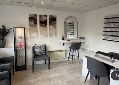 Elegant interior of SummerLily Nails, Rainhill, England, GB, featuring modern decor and nail polish displays.