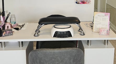 Modern nail station setup at SummerLily Nails in Rainhill, England, GB, with tools and price list displayed.