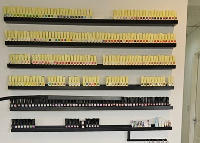 Colorful nail polish display at SummerLily Nails, Rainhill, England, GB showcasing diverse shades.