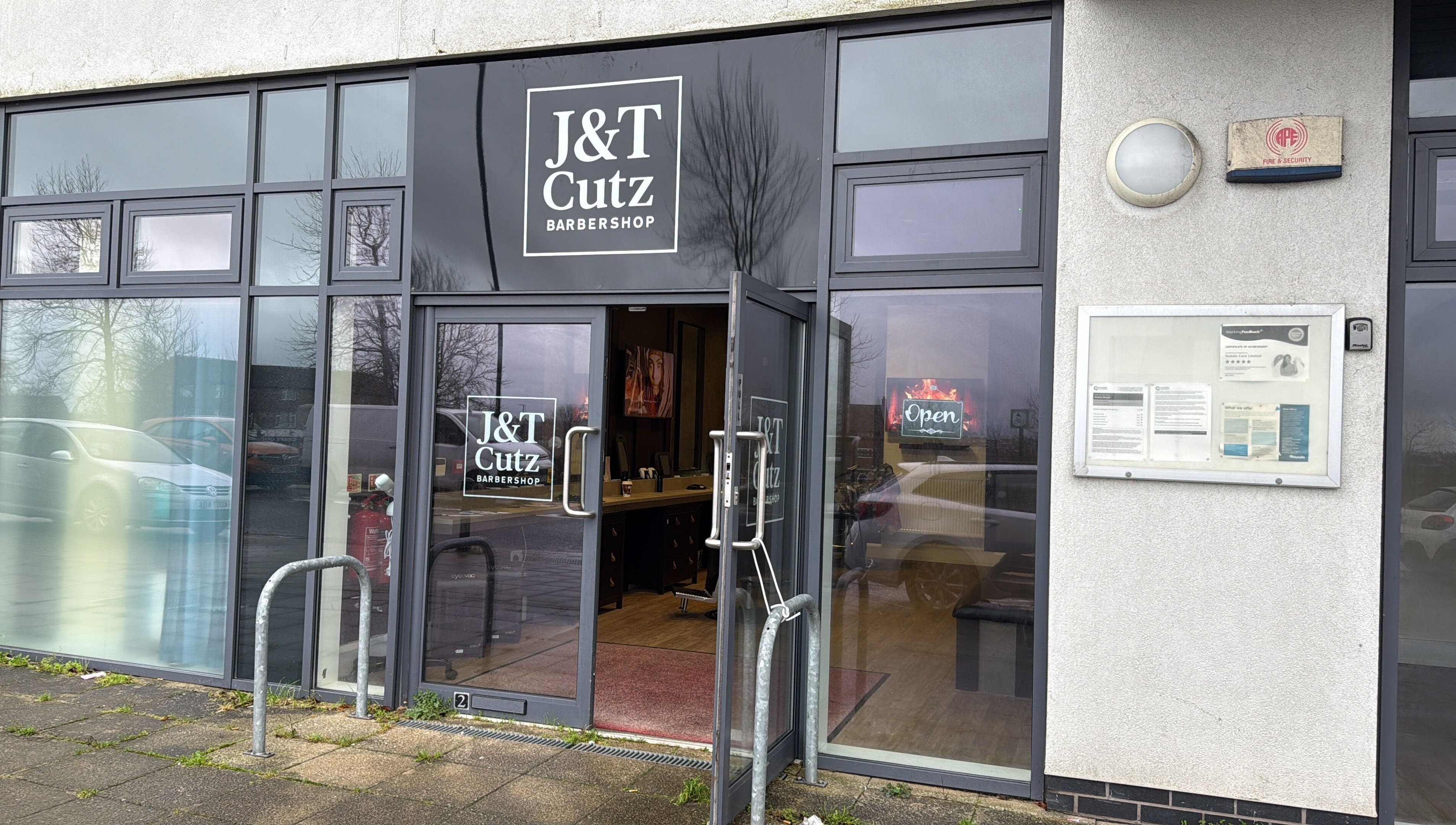 Front view of J&T Cutz LTD barbershop in Bristol, England, GB, showcasing stylish entrance.