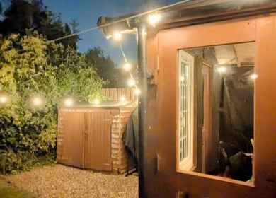 Garden Nail Haven's cozy outdoor area with string lights in Chester, England, GB.