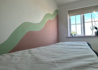 Serene beauty room at 33 Beauty and Aesthetics, Ilkeston, England, GB with a calming wall mural and bright window.