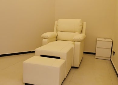Comfortable white chair in relaxation room at Third Eye Peace Spa, Dubai, AE.
