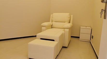 Comfortable white chair in relaxation room at Third Eye Peace Spa, Dubai, AE.
