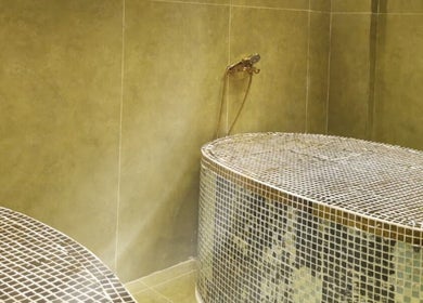 Luxurious spa treatment room at Third Eye Peace Spa in Dubai, AE, featuring elegant tiled decor.