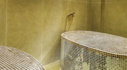Luxurious spa treatment room at Third Eye Peace Spa in Dubai, AE, featuring elegant tiled decor.