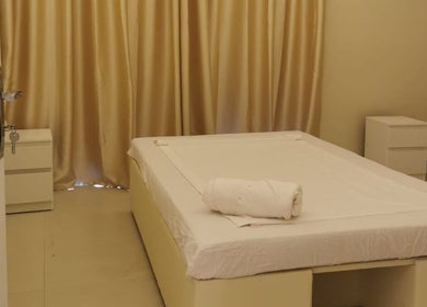 Peaceful massage room at Third Eye Peace Spa Al Jaddaf, Dubai, AE with soft lighting and a cozy bed.