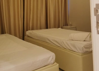Peaceful treatment room with two beds at Third Eye Peace Spa Al Jaddaf, Dubai, AE.
