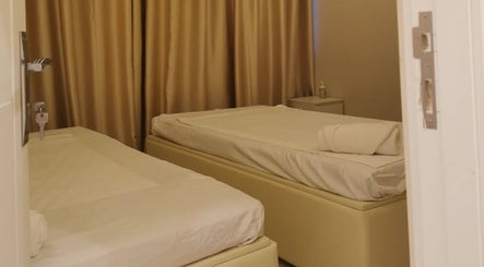 Peaceful treatment room with two beds at Third Eye Peace Spa Al Jaddaf, Dubai, AE.