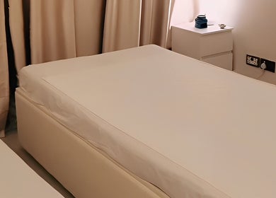 Calming massage bed at Third Eye Peace Spa Al Jaddaf, Dubai, AE. Soft lighting enhances relaxation ambiance.