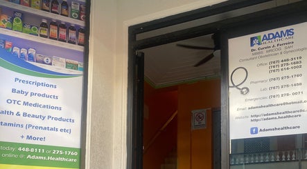 Entrance of Adams House of Aesthetics, Roseau, Saint George Parish, DM, displaying service offerings.