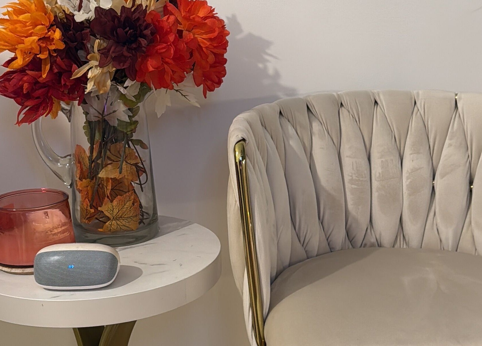 Elegant sitting area at Aura Sanctuary, New York, featuring plush chair and floral decor.
