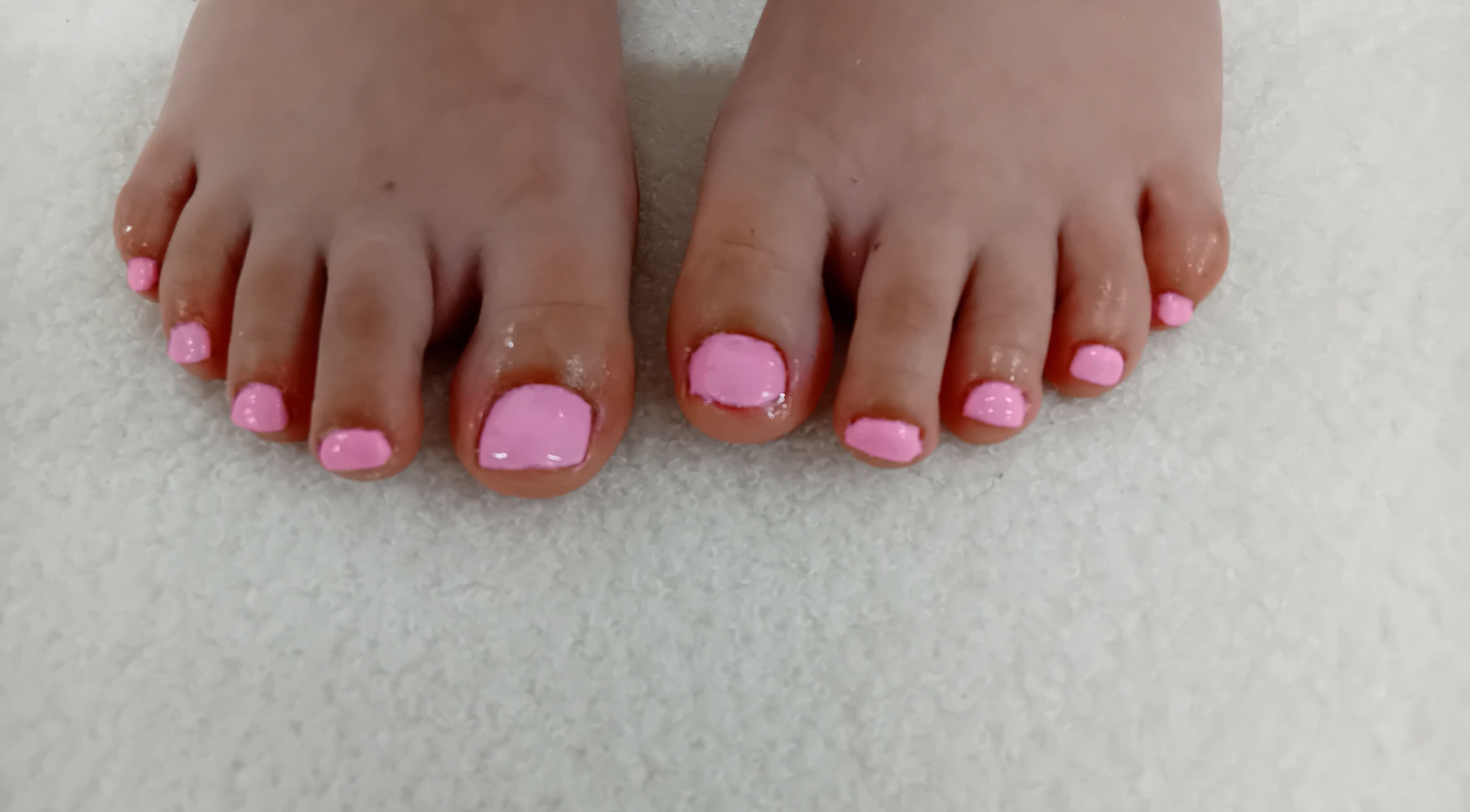 Bright pink toenails freshly painted at Michelle's Beauty Boutique in Rossendale, England, GB.
