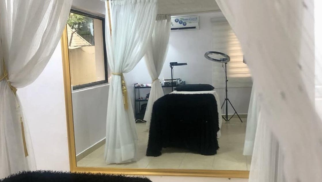 Elegant treatment room at Beauty Bottega, Lekki, Lagos, NG with cozy decor and ambient lighting.