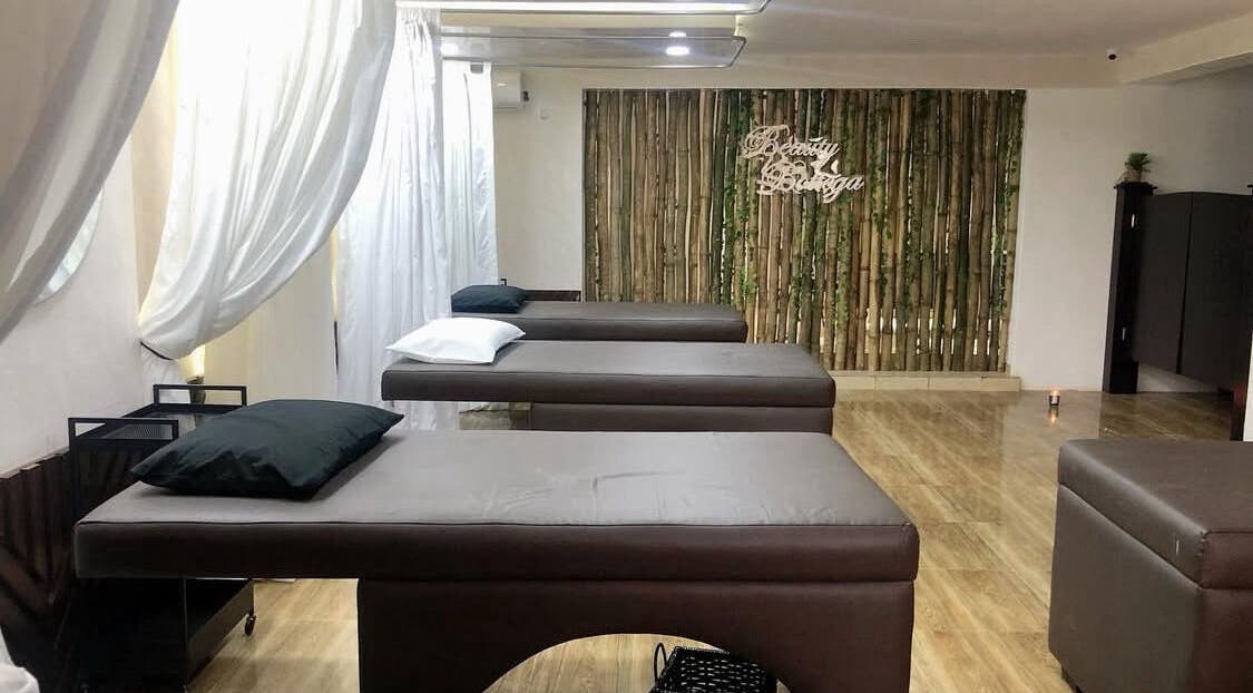 Relaxing spa beds at Beauty Bottega, Lekki, Lagos, NG, with a tranquil ambiance and bamboo decor.