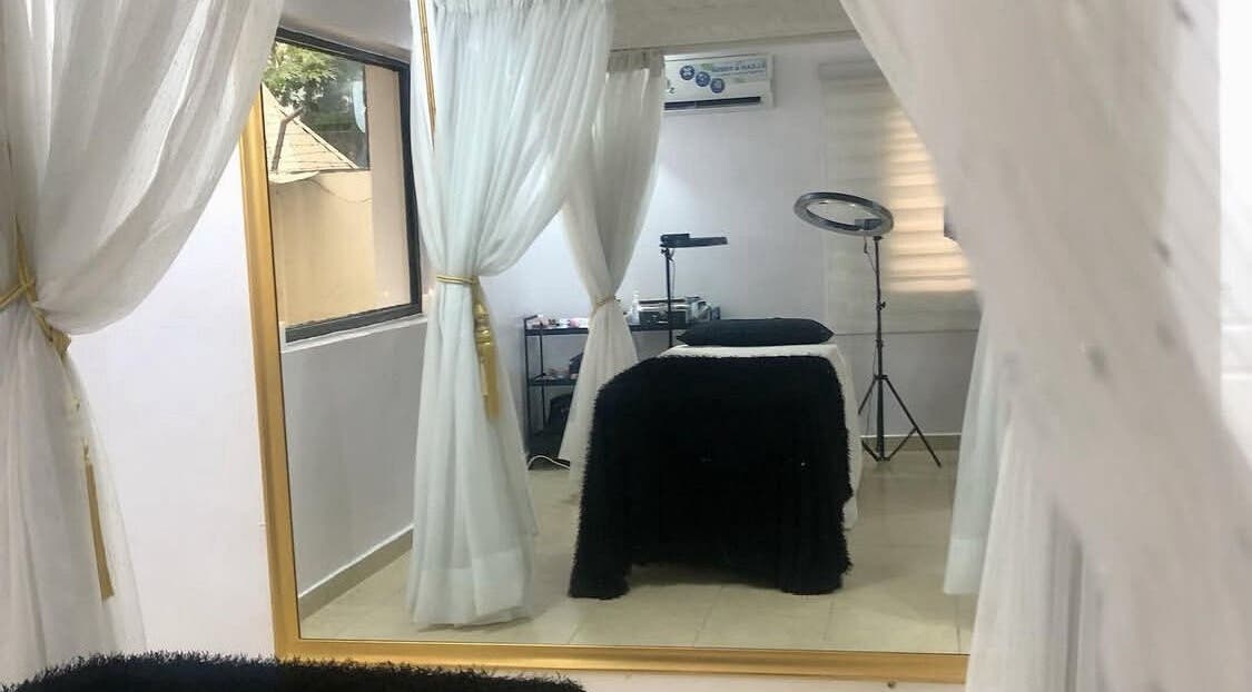 Tranquil treatment room at Beauty Bottega, Lekki, Lagos, NG with elegant drapes and relaxing ambiance.