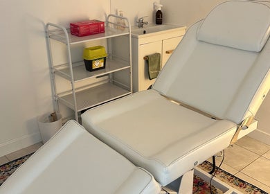 Relaxing spa room at Wellness Space Lifestyle Medicine, Glasgow, Scotland, GB, featuring a comfortable massage bed.