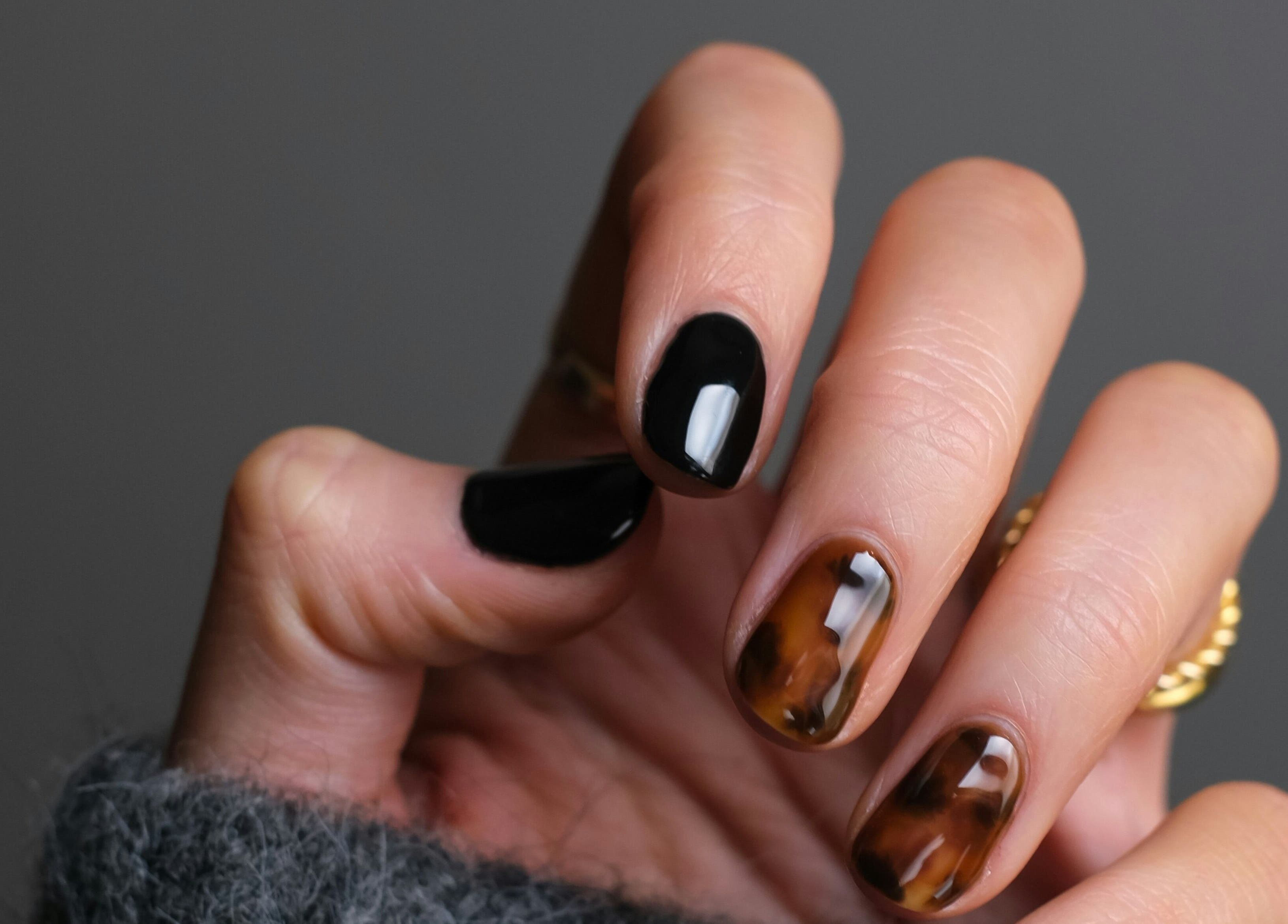 Stylish manicure with black and tortoiseshell nails at Kulture Beauty Art, London, England, GB.