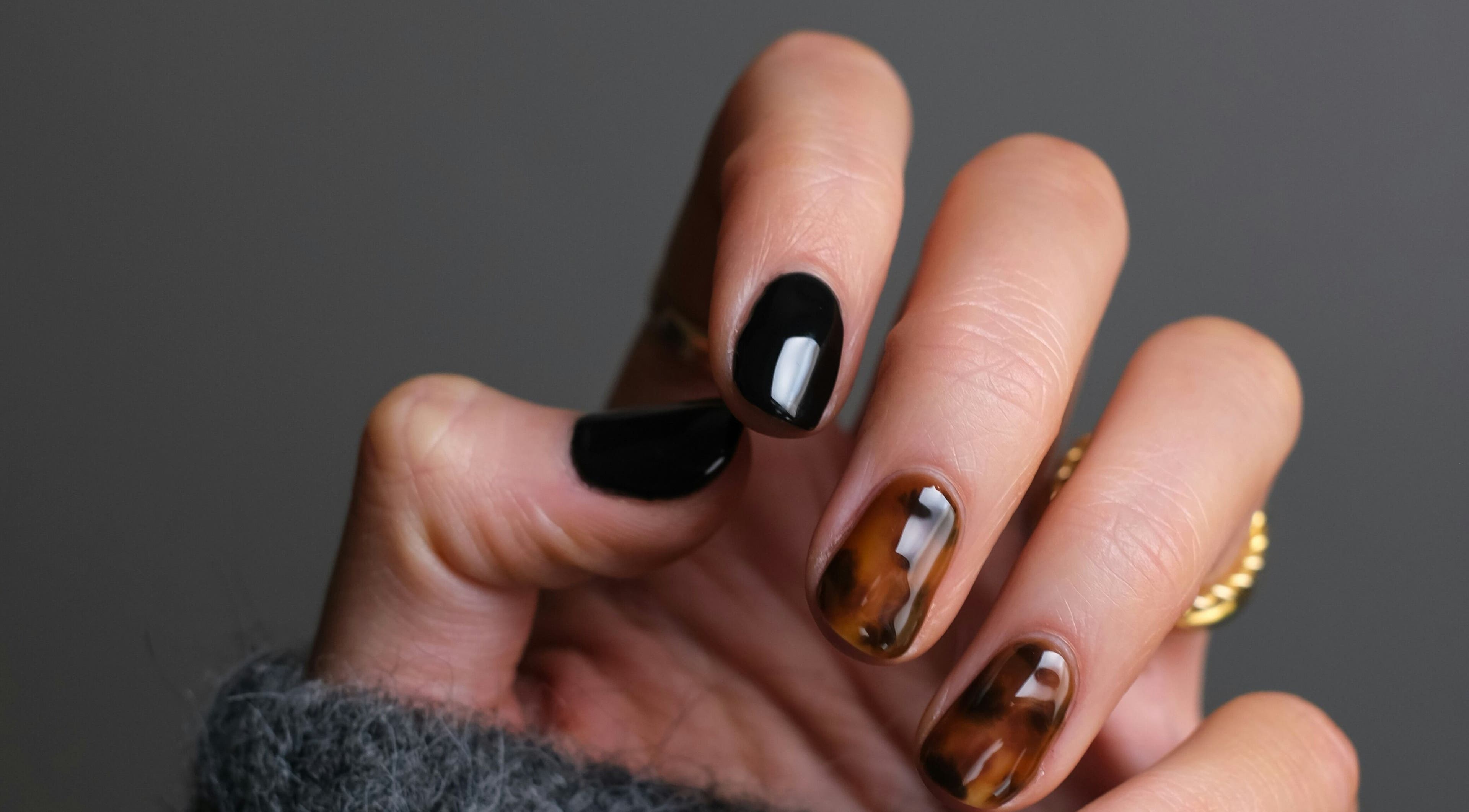 Stylish manicure with black and tortoiseshell nails at Kulture Beauty Art, London, England, GB.