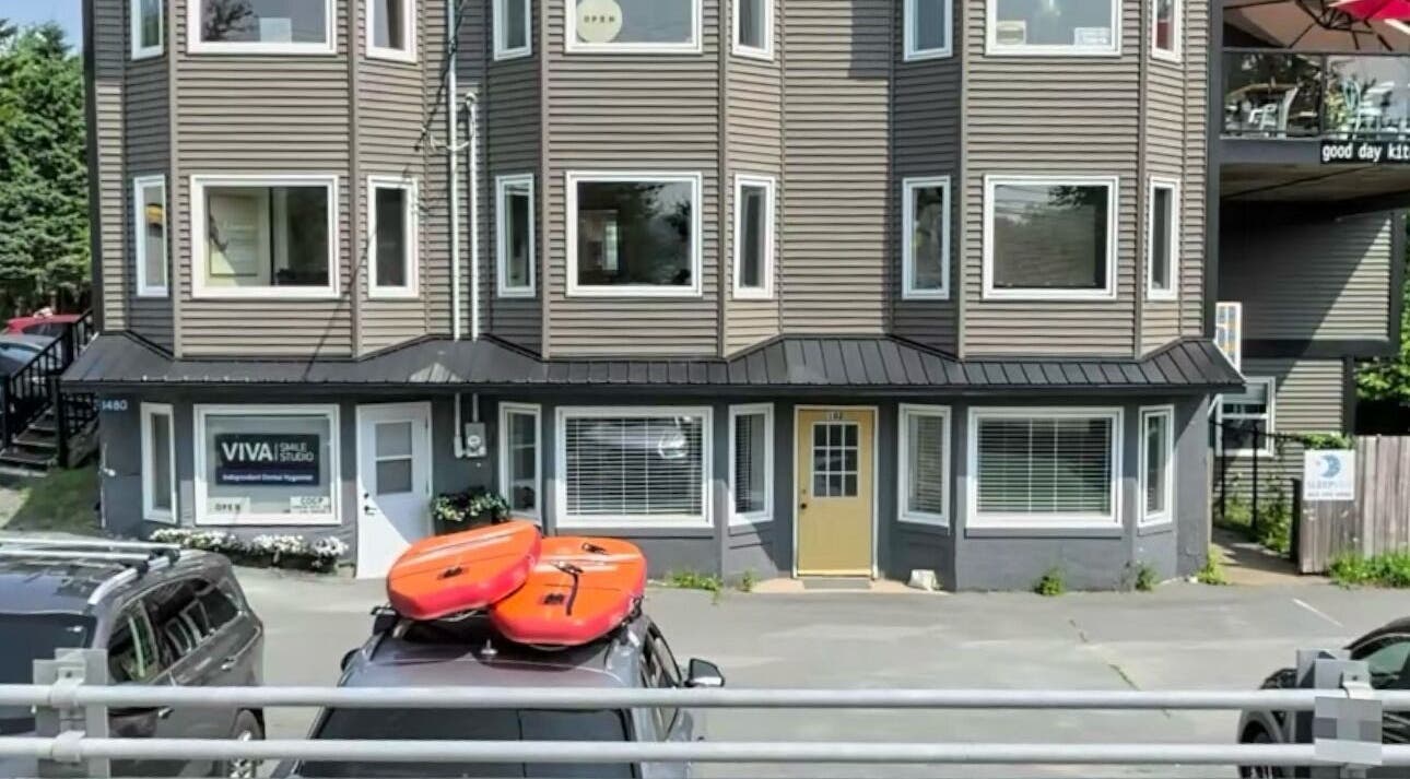 Exterior view of Lashes By Asia, Fall River, Nova Scotia, CA; showcasing vibrant kayaks on a vehicle.