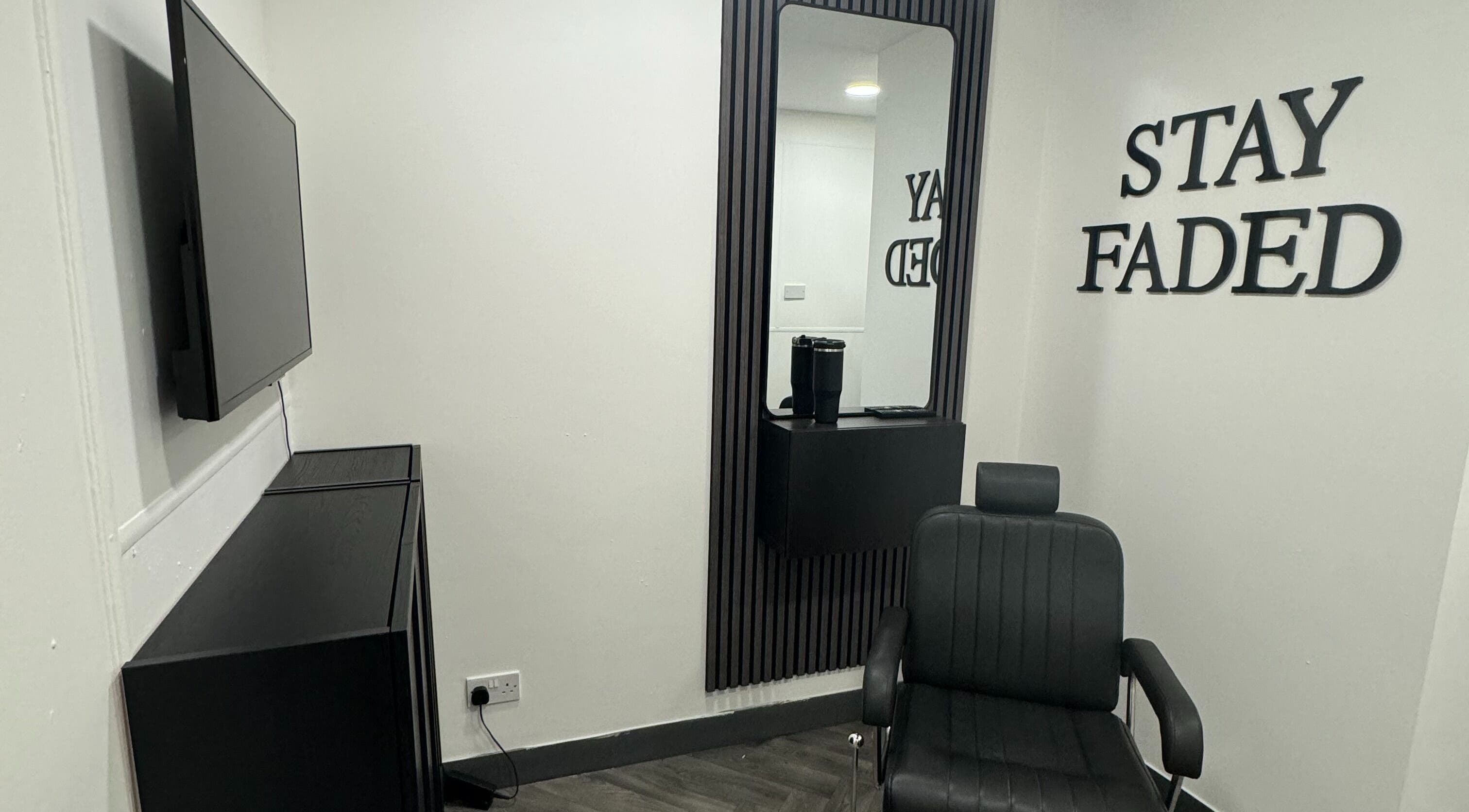 Modern salon interior at Stay Faded, featuring sleek decor and styling chair in Birmingham, England, GB.