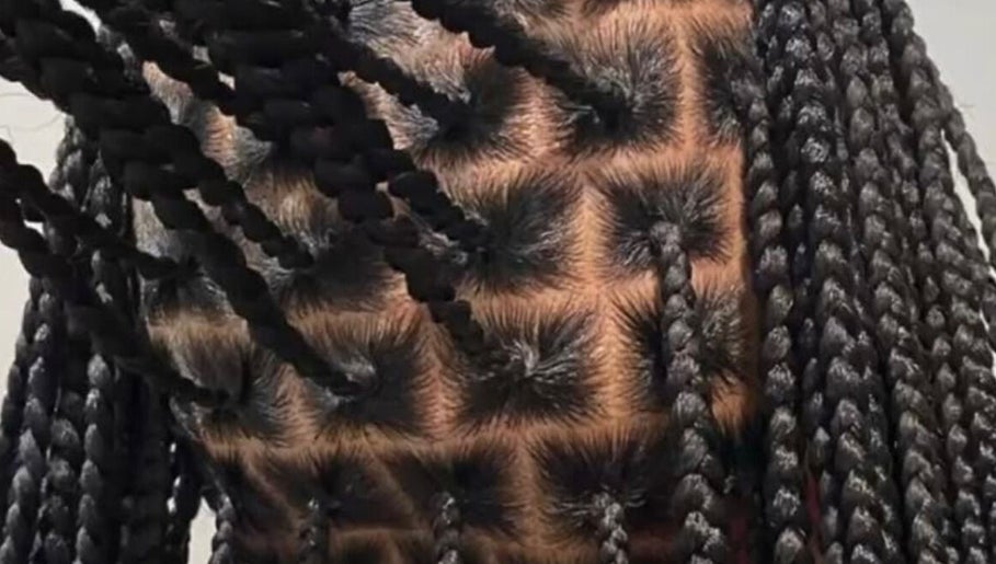 Detailed view of intricate braided hairstyle at DoneByZay, London, England, GB.
