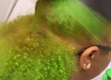 Bold green hairstyle with curls at DoneByZay, London, England, GB.