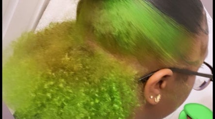 Bold green hairstyle with curls at DoneByZay, London, England, GB.