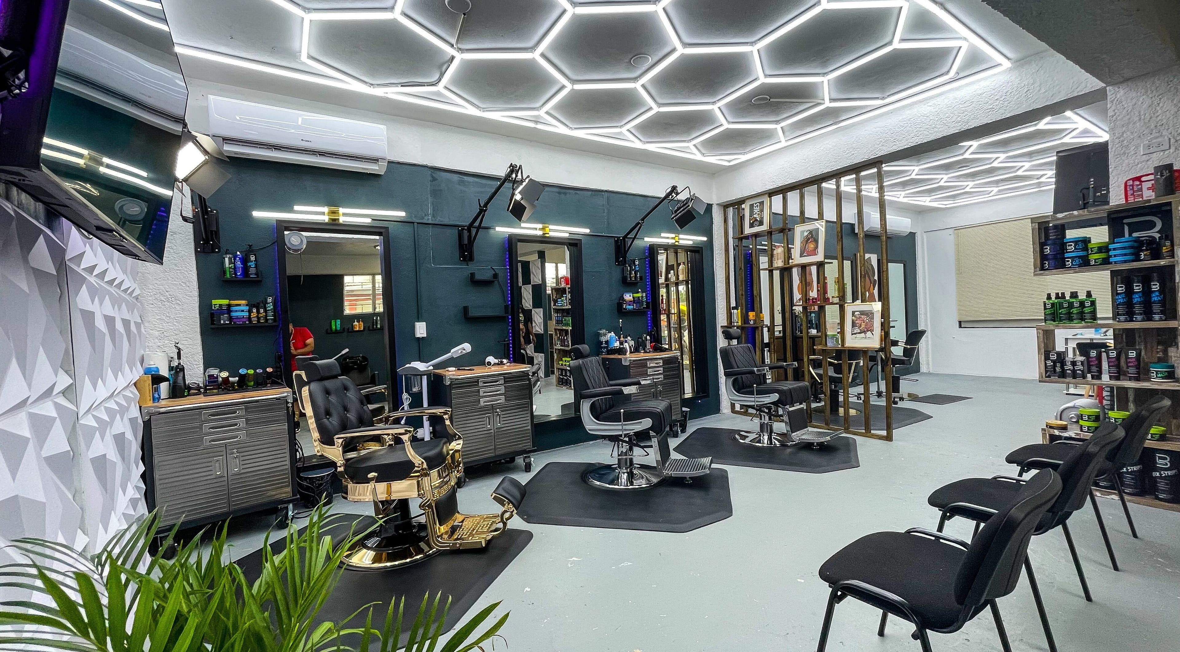 Modern interior of Fresh Again Self Care Studio in The Valley, AI with stylish barber chairs and sleek lighting.